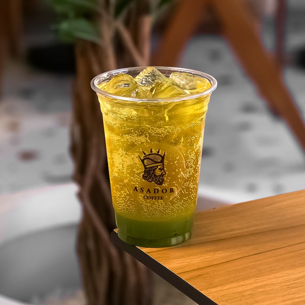 Iced Kiwi Land Energy Drink with Fresh Kiwi Slices in Plastic Cup at Asador Coffee El Jadida