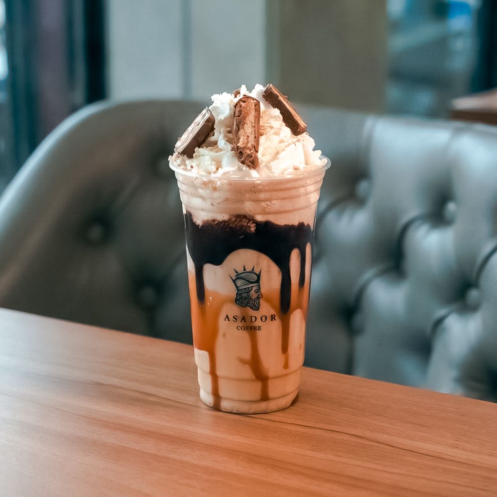 Snickers Milkshake with Peanut Butter and Chocolate Sauce in Plastic Cup at Asador Coffee El Jadida