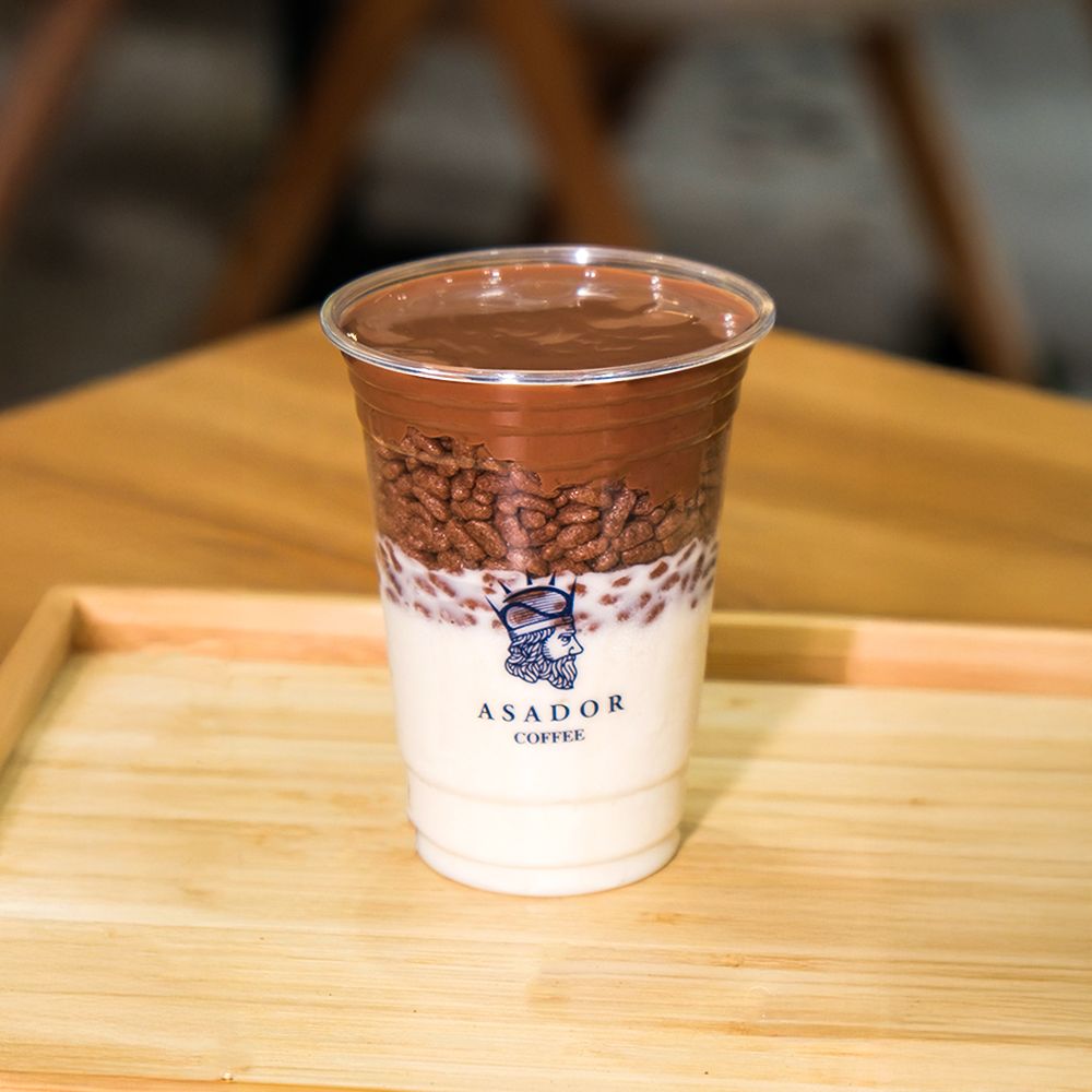 Milk Chocolate Ice Cream Drink with Layer of Crispy Rice in Plastic Cup at Asador Coffee El Jadida
