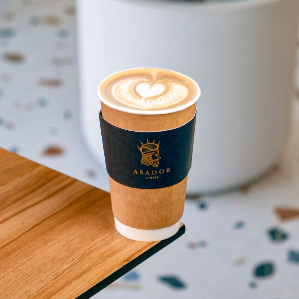 Barista Pouring Latte Art on Flat White Coffee at Asador Coffee El Jadida