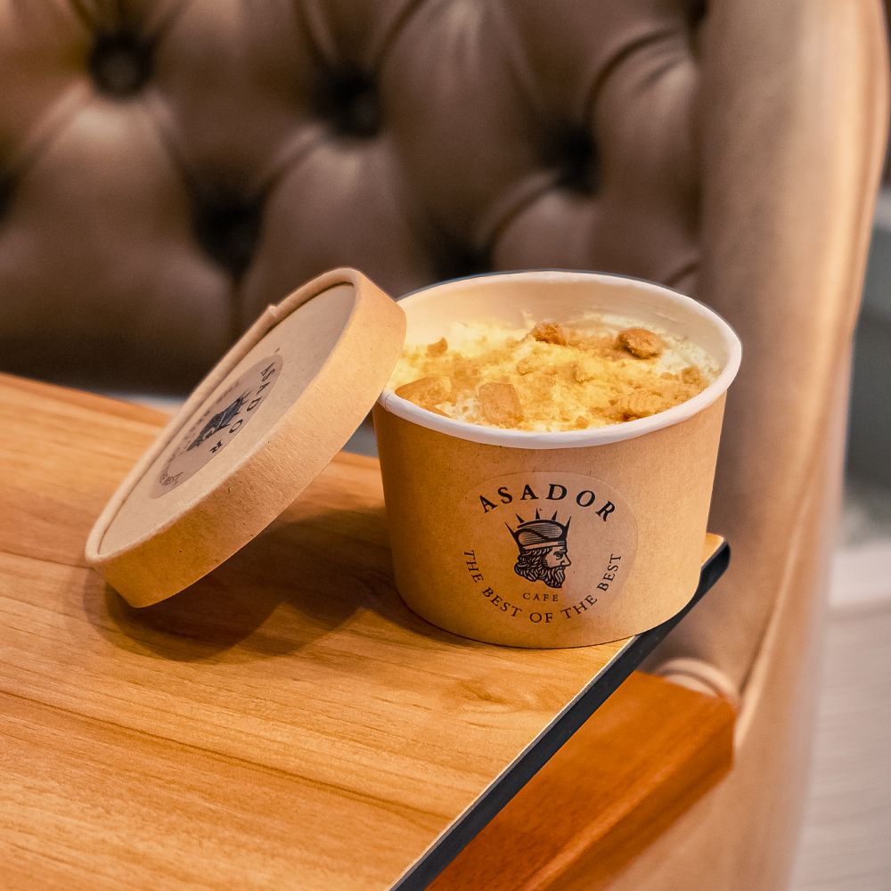 Classic Banana Pudding Dessert Cup Topped with Crushed Wafers at Asador Coffee El Jadida