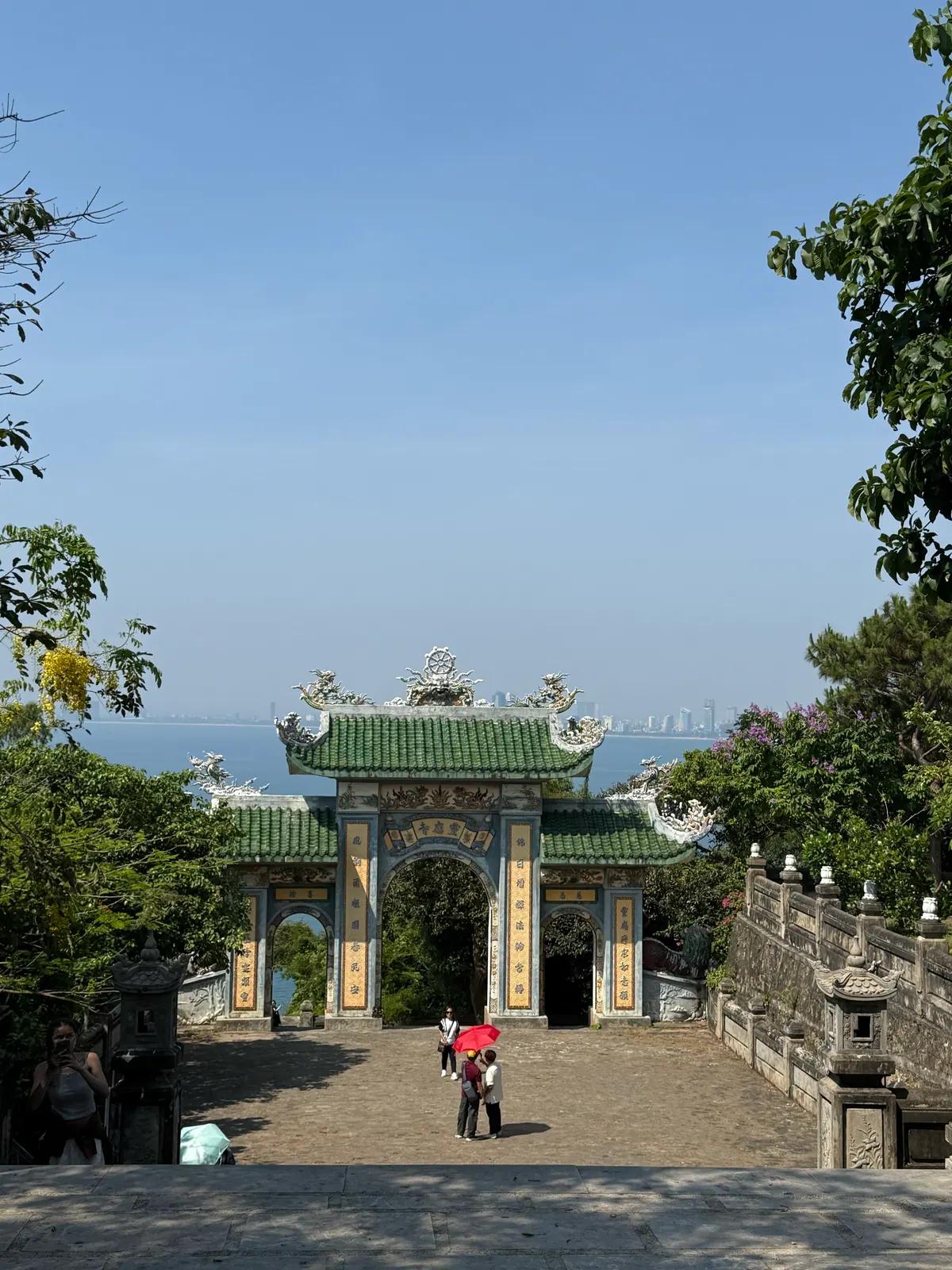 The old stone gate on the Marble Mountains with the coast beyond