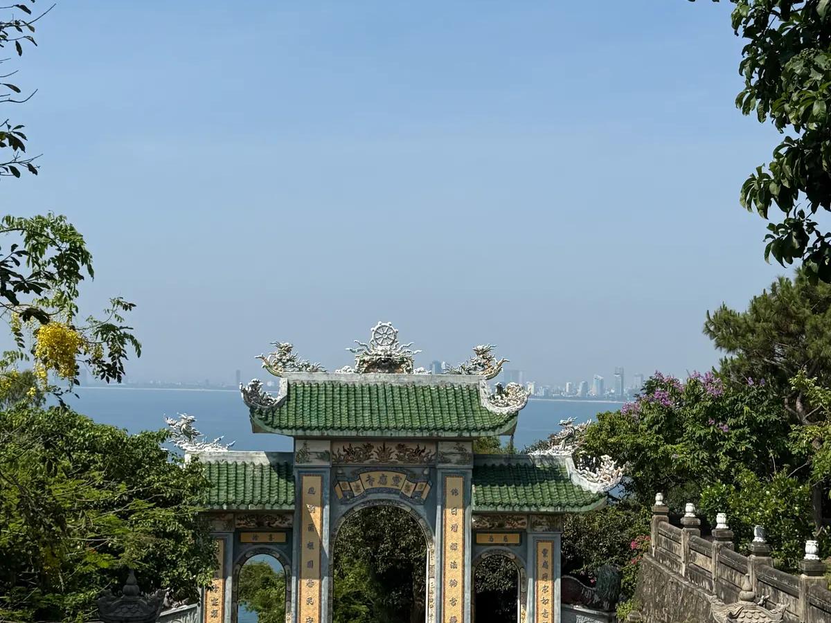 The old stone gate on the Marble Mountains with the coast beyond