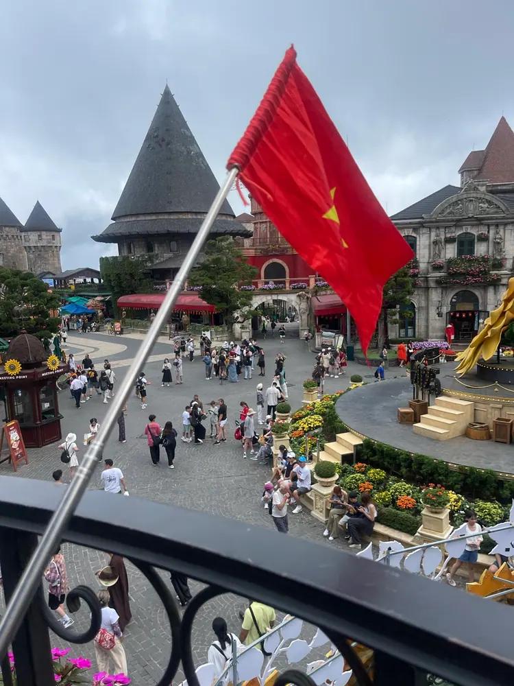 The French Village square at Ba Na Hills with its towers and flag
