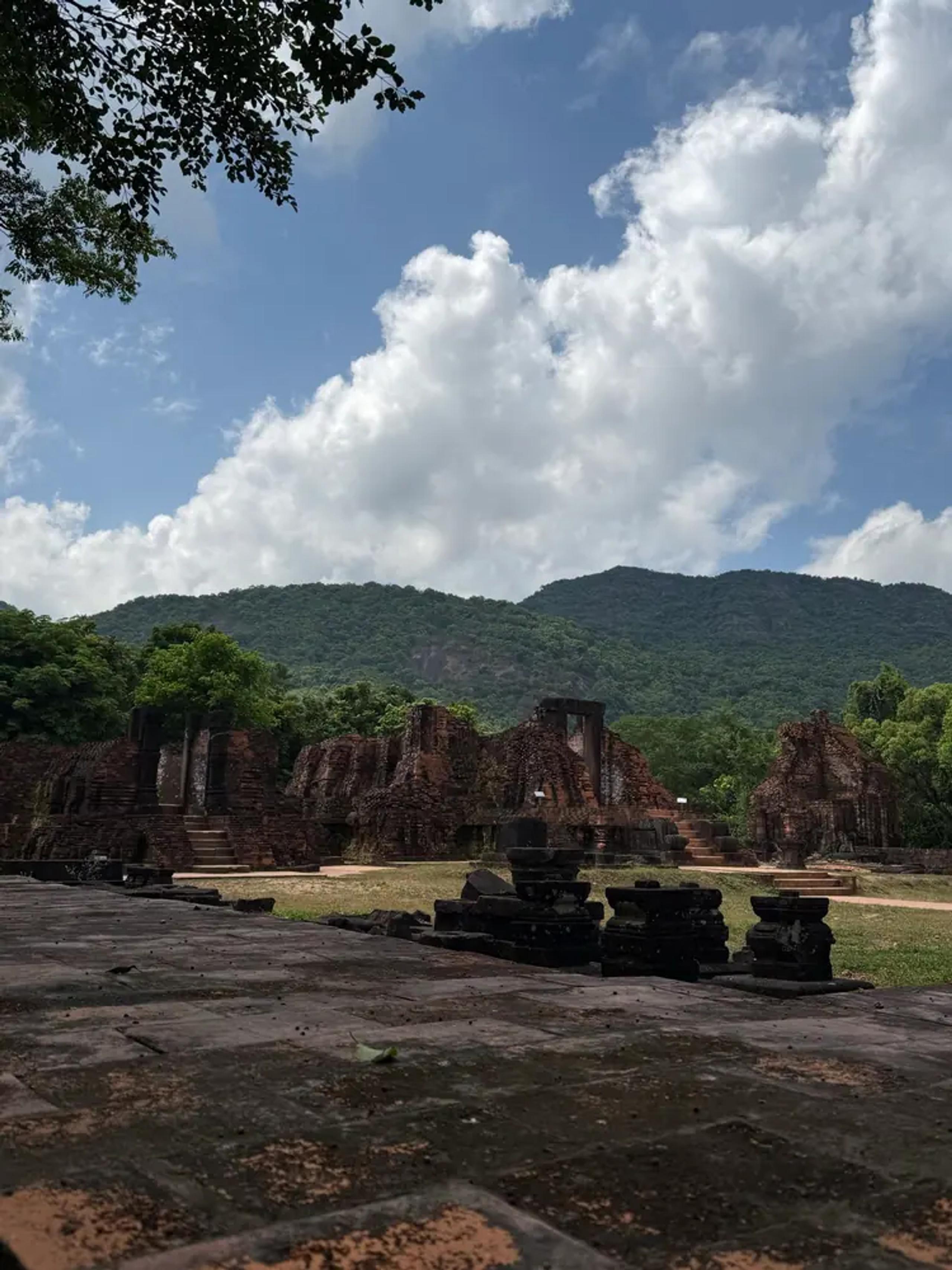 The My Son temple groups spread across the valley floor below forested mountains