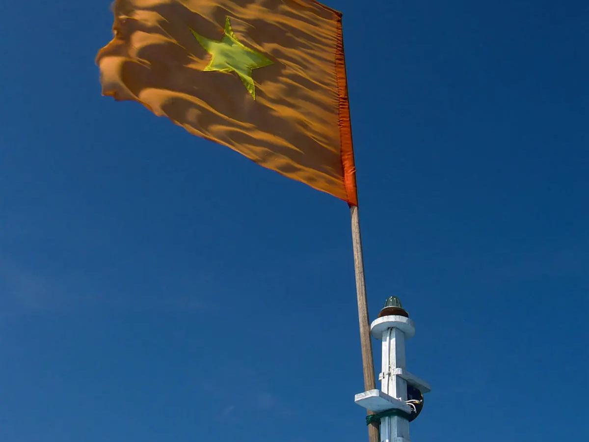 Vietnamese flag flying from a boat mast off Cu Lao Cham