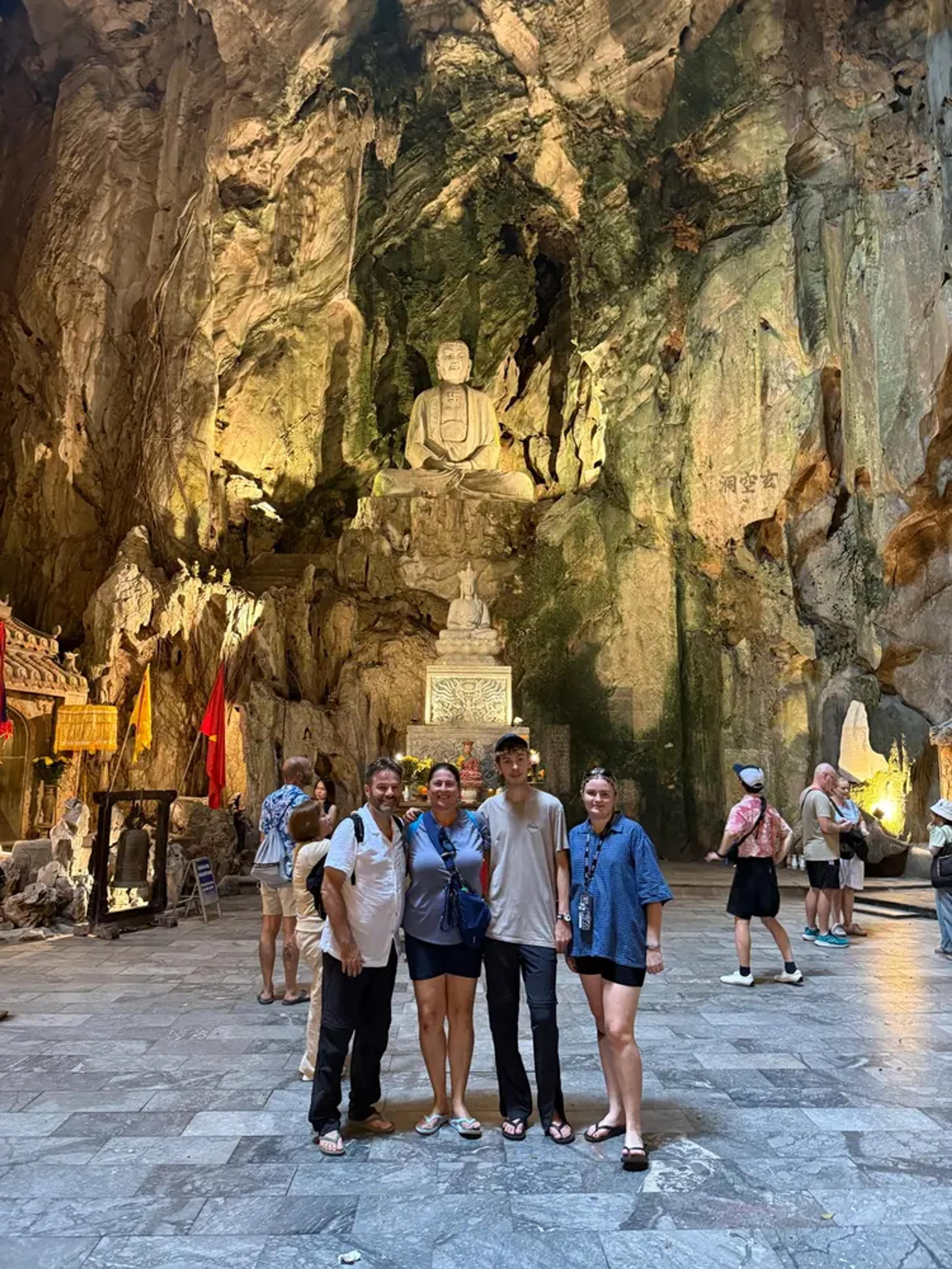 The big chamber of Huyen Khong Cave with its shrines lit from above