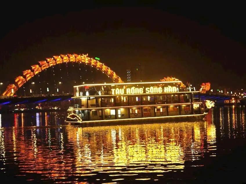 An illuminated dragon boat on the Han River at night