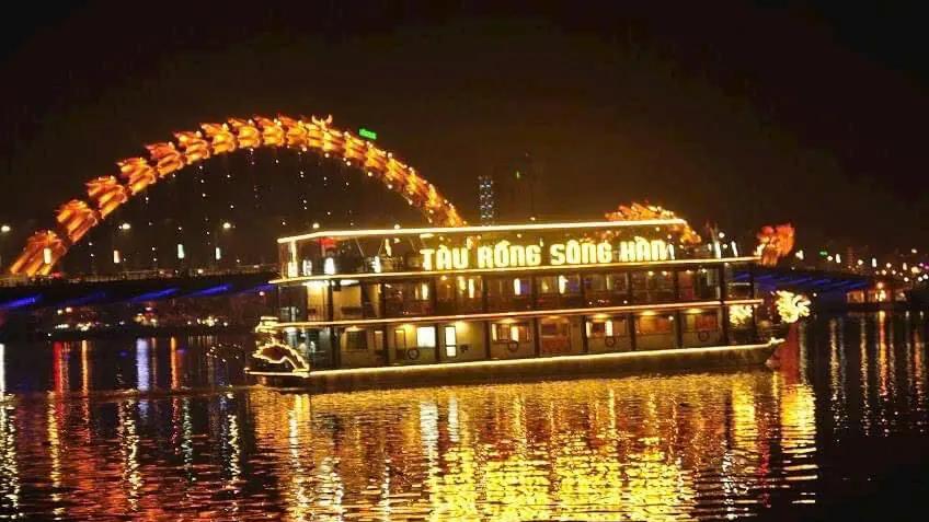 An illuminated dragon boat on the Han River at night