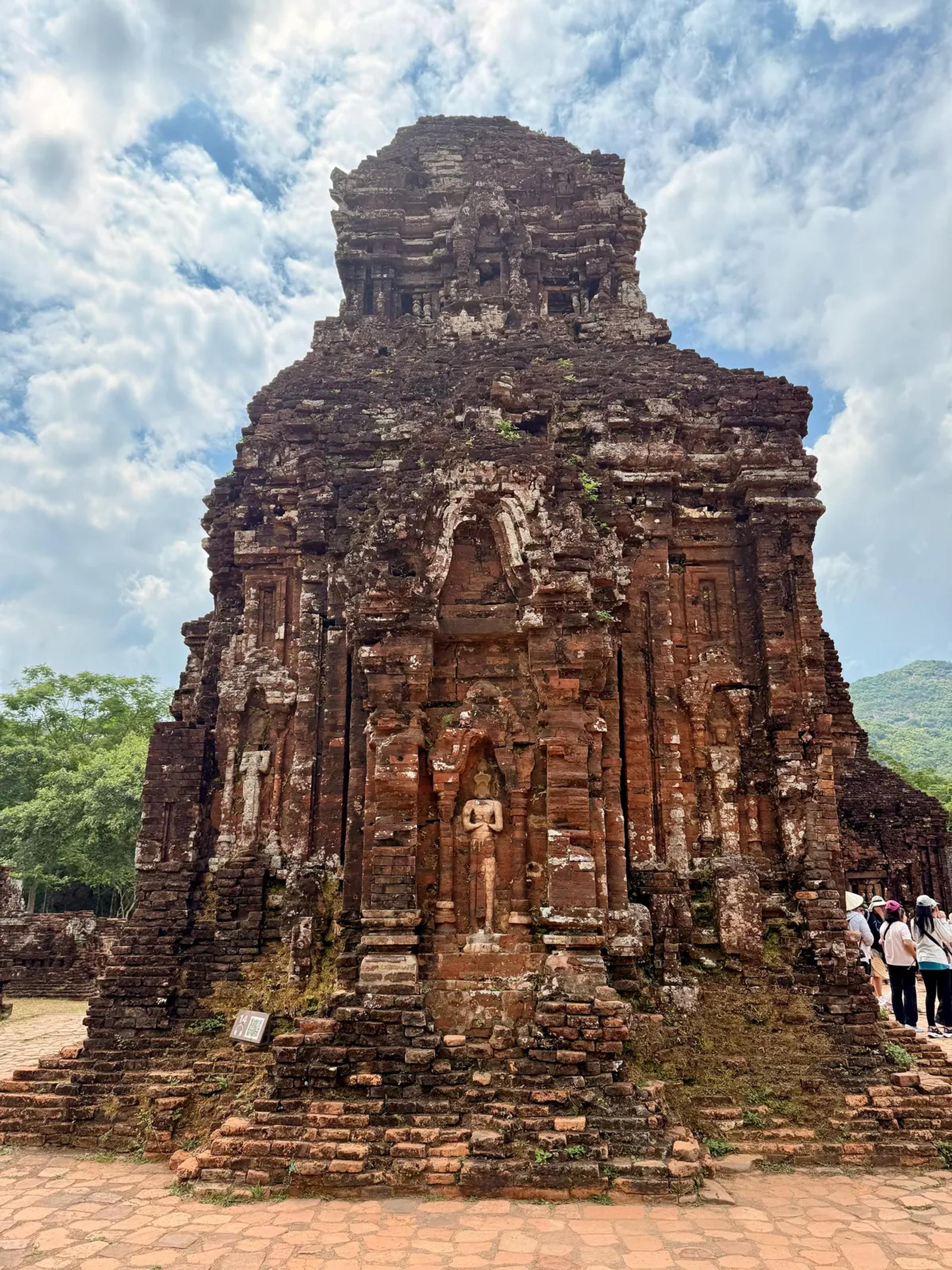 A Champa brick tower standing in the My Son Sanctuary valley