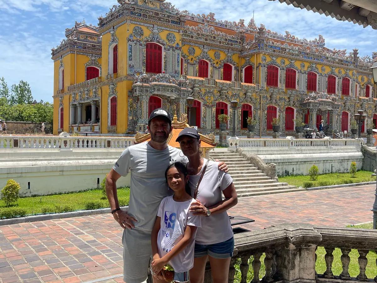A family in front of the restored Kien Trung Palace in the Hue Imperial Citadel