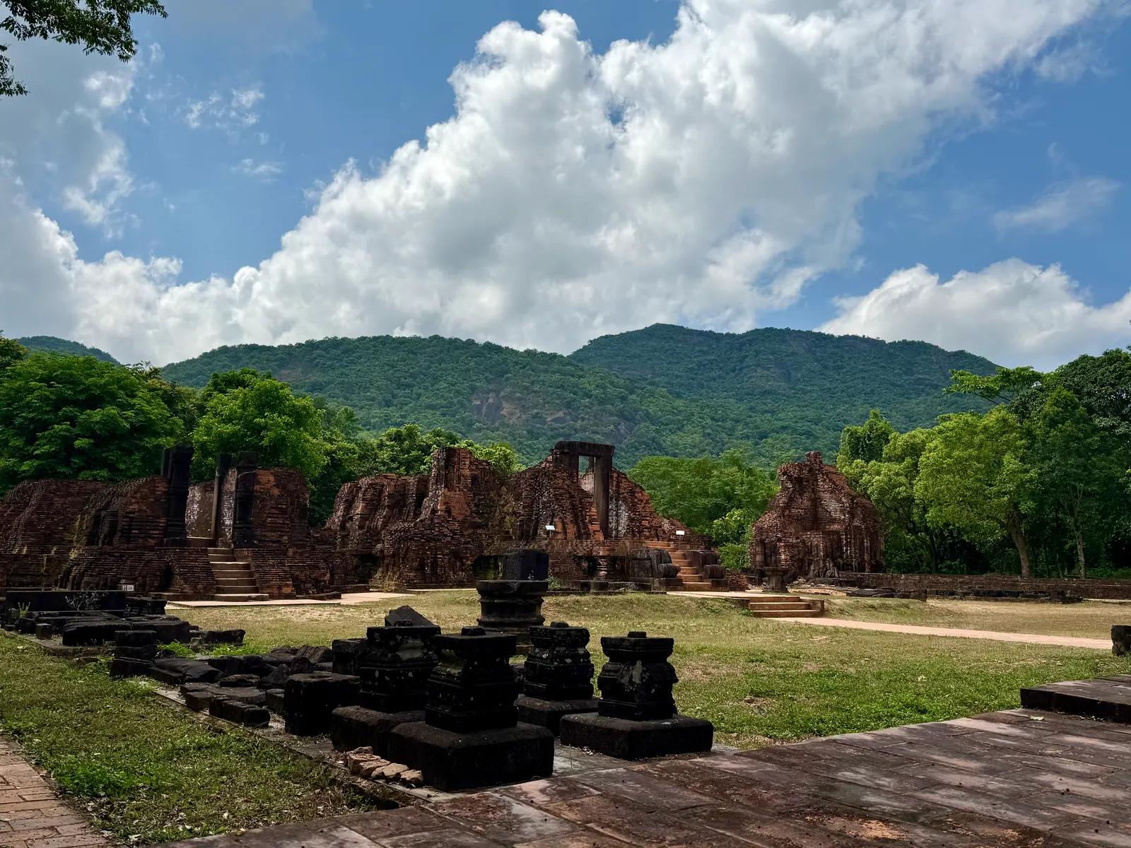 The My Son temple groups with the forested mountains behind them