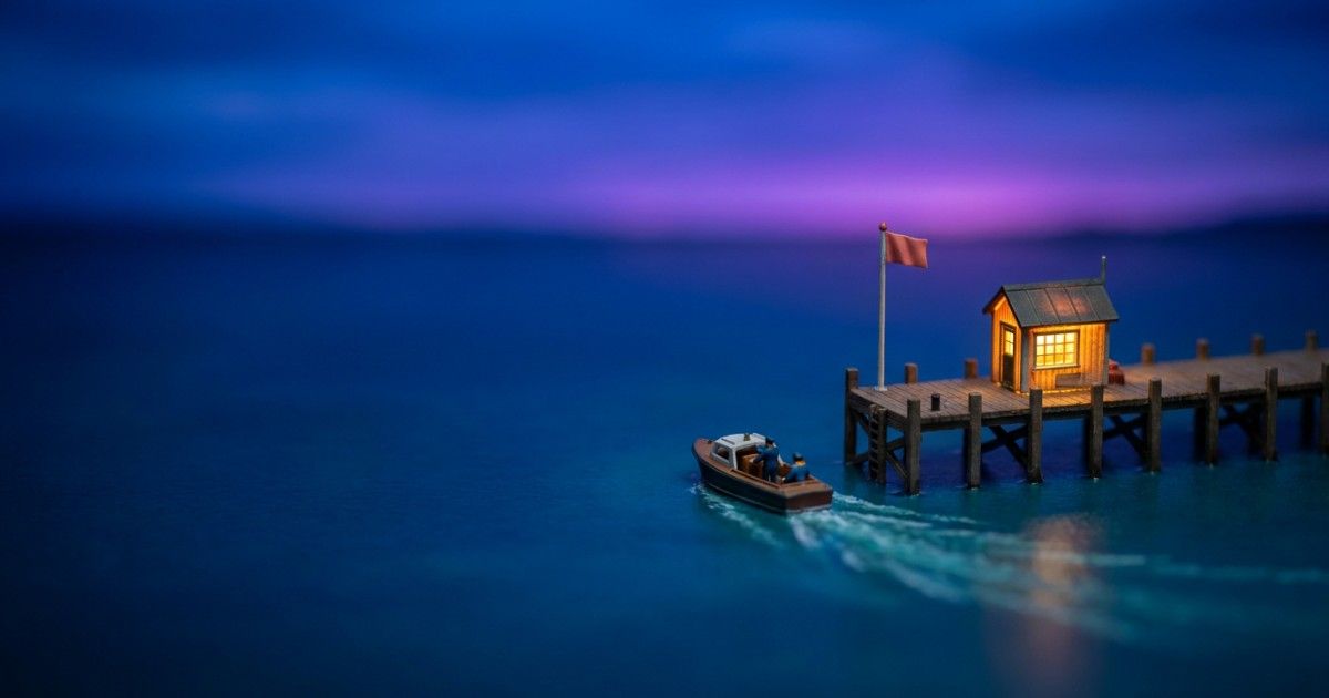 Miniature harbour where a raised flag prompts a pilot boat to set out: risk flags helping teams respond faster