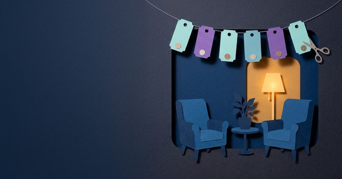 Paper-cut therapy room with two armchairs under bunting of session tickets: session-based billing for therapy