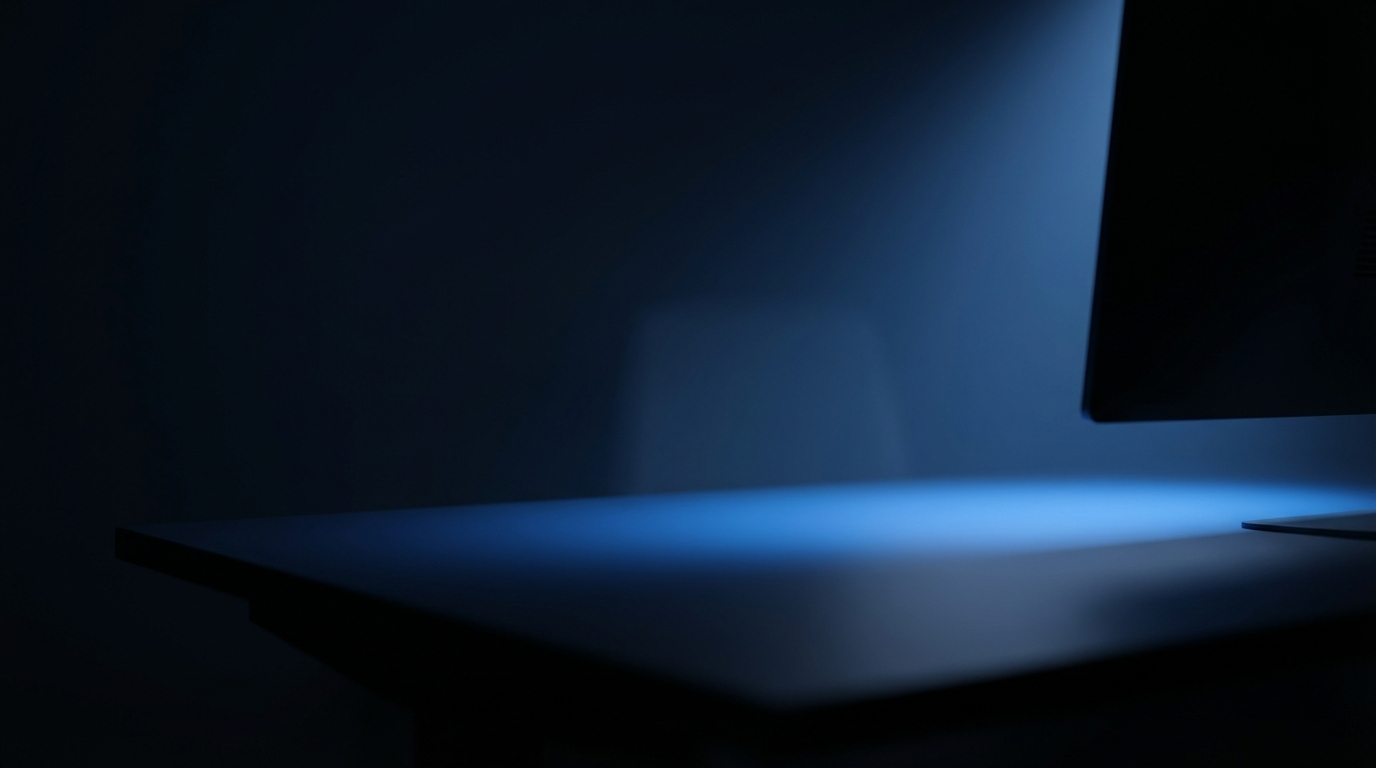 trading monitor casting soft blue light across a dark desk, representing the start of a futures trading journey for beginners