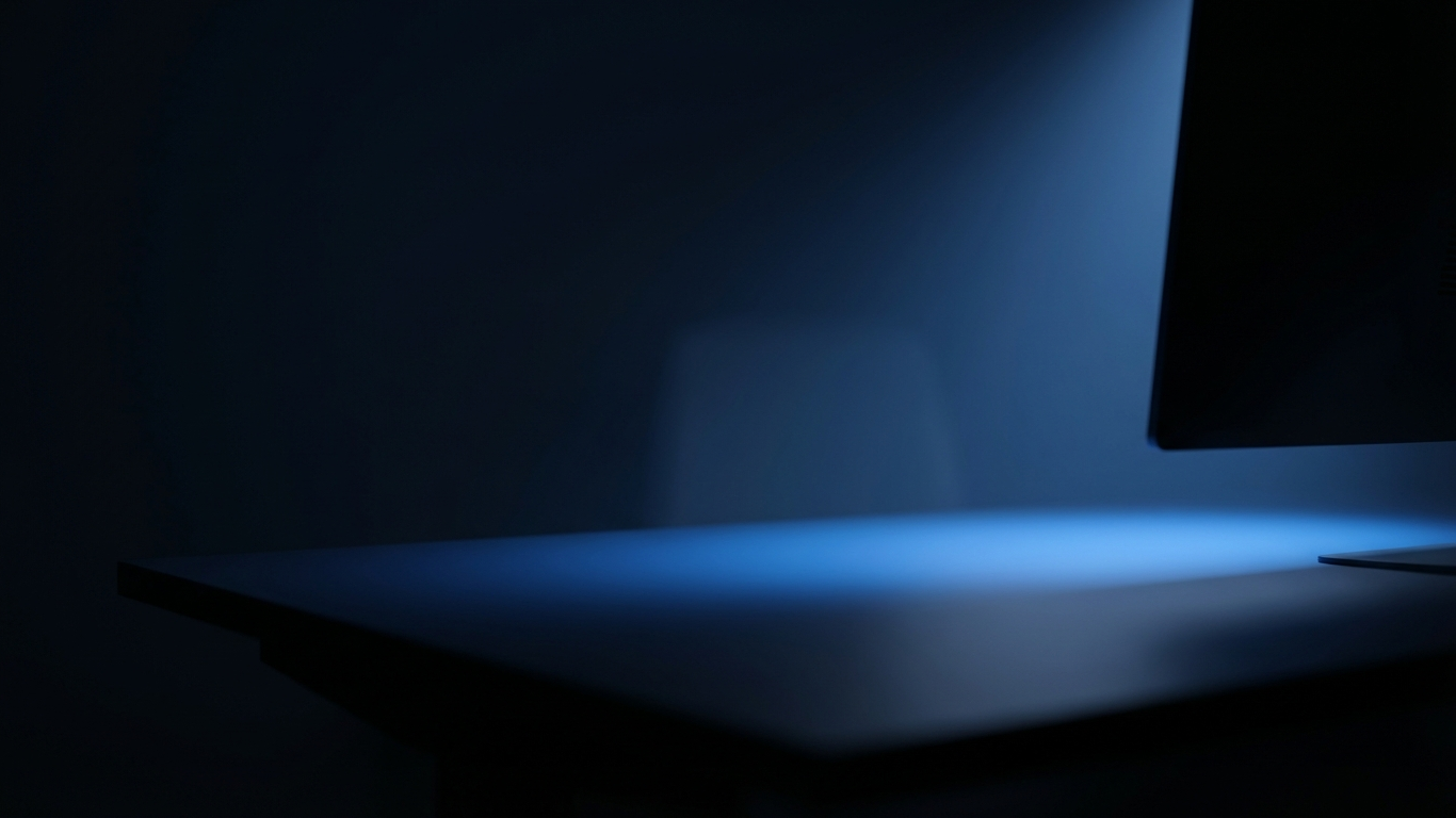 trading monitor casting soft blue light across a dark desk, representing the start of a futures trading journey for beginners