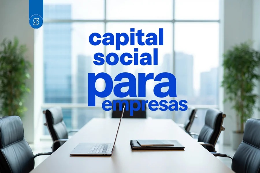 Sala de reunião vazia com mesa branca e poltronas, com a inscrição capital social para empresas