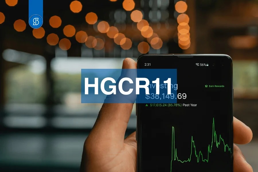 Celular exibindo tela de investimentos com gráfico verde e saldo, com o código HGCR11 em faixa azul ao centro
