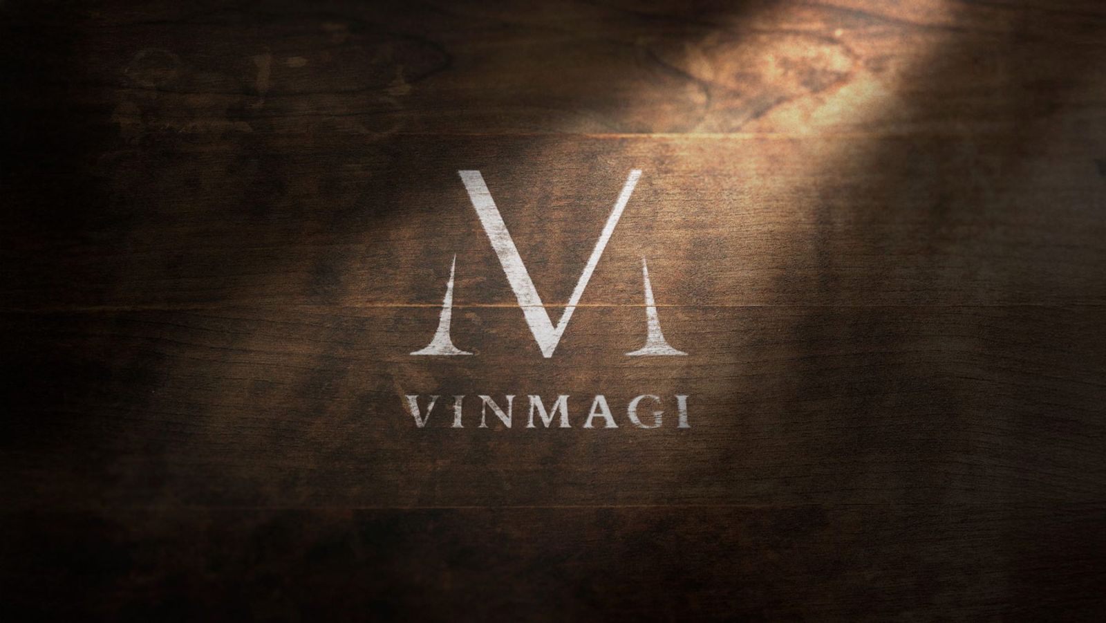 Vinmagi-logo malt på tre