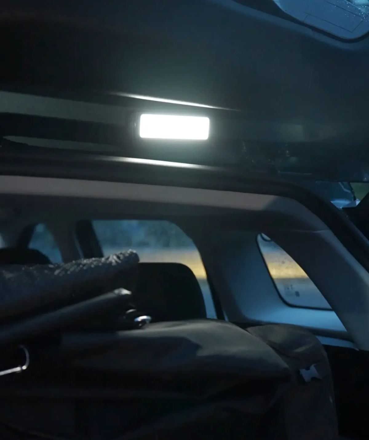 JAECOO boot-fitted flashlight lighting the load bay at night