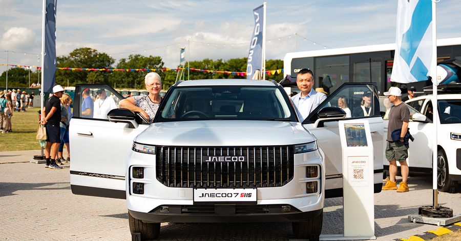 Visitors looking around the JAECOO 7 on the OMODA&JAECOO CarFest stand