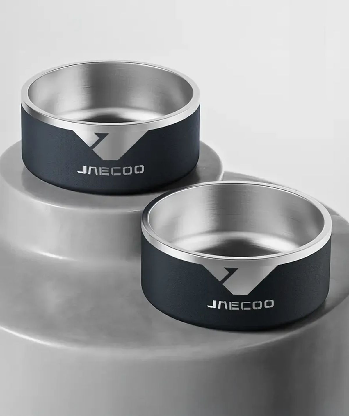 Two JAECOO pet bowls in different sizes, showing the branded outer sleeve
