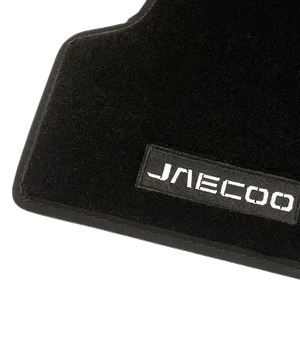 Close-up of a genuine JAECOO floormat showing the stitched JAECOO logo badge