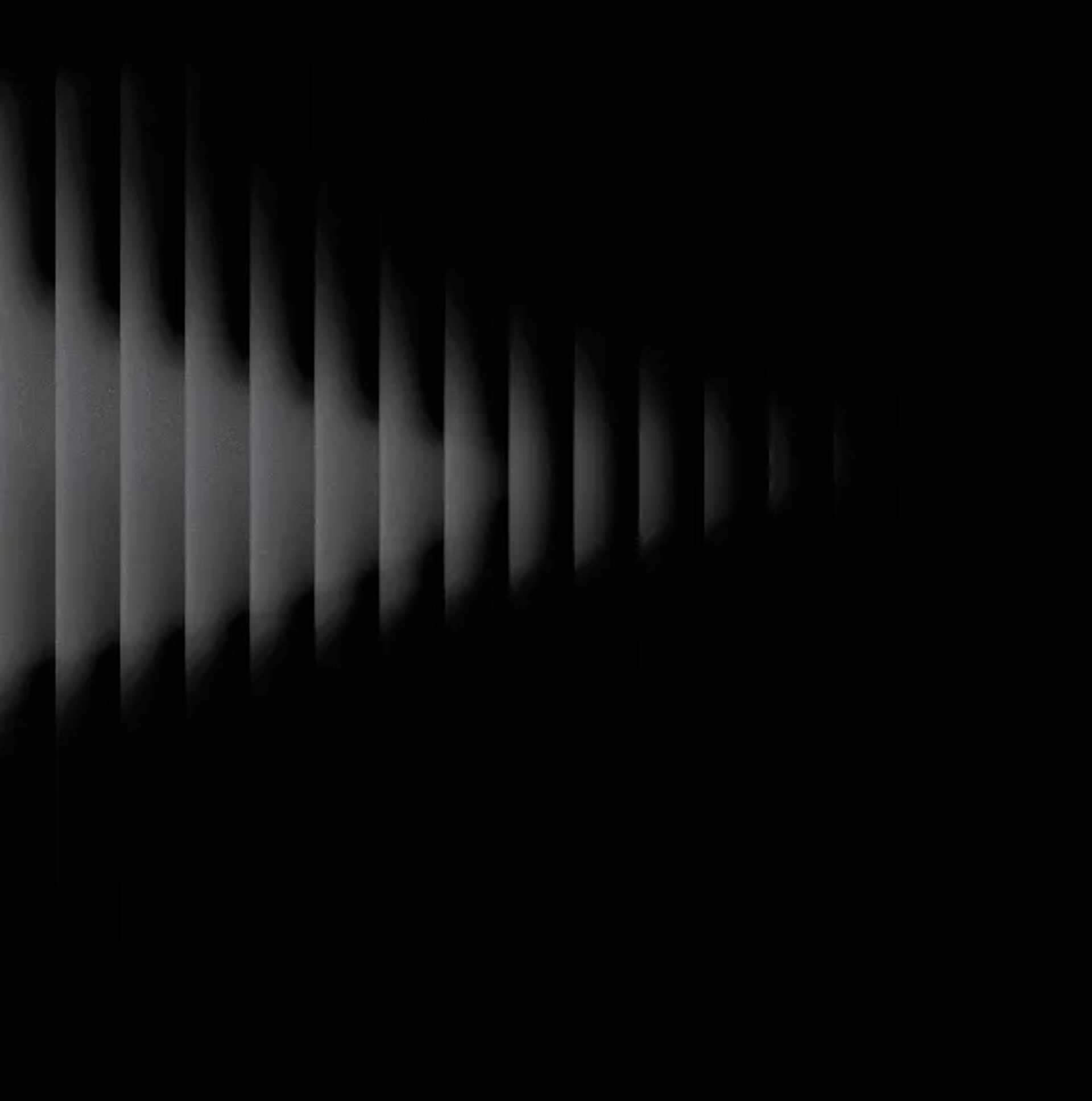 Dark grey ribbed background with light beam