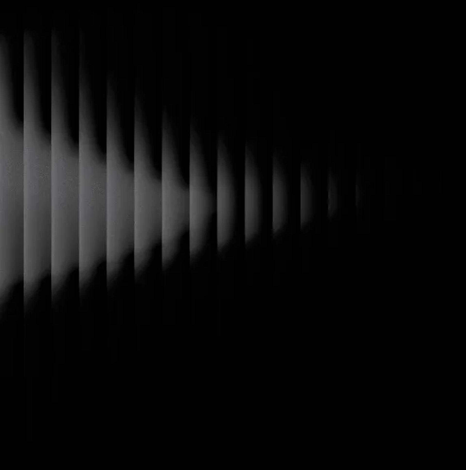 Dark grey ribbed background with light beam