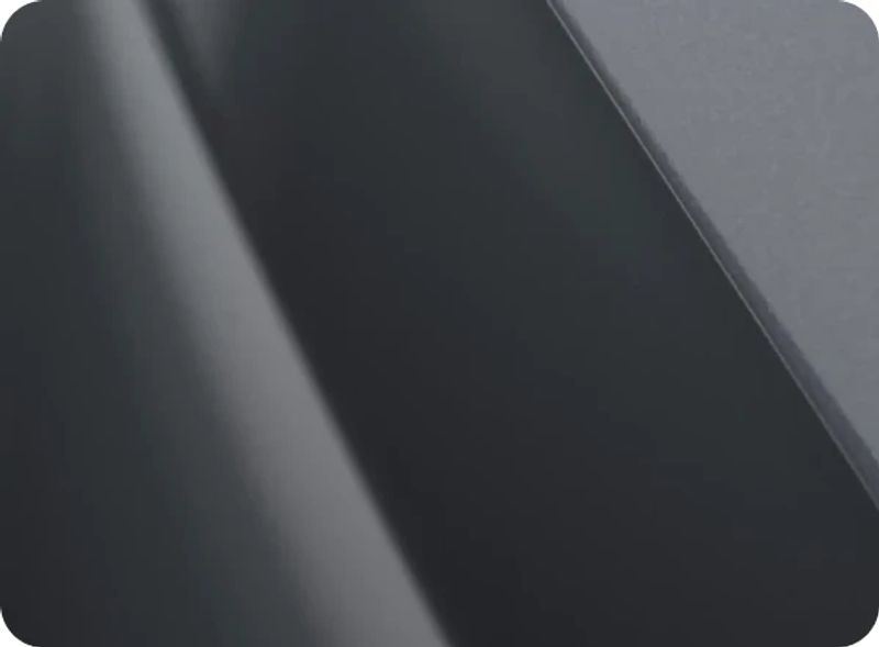 Close-up of a glossy dark OMODA body panel