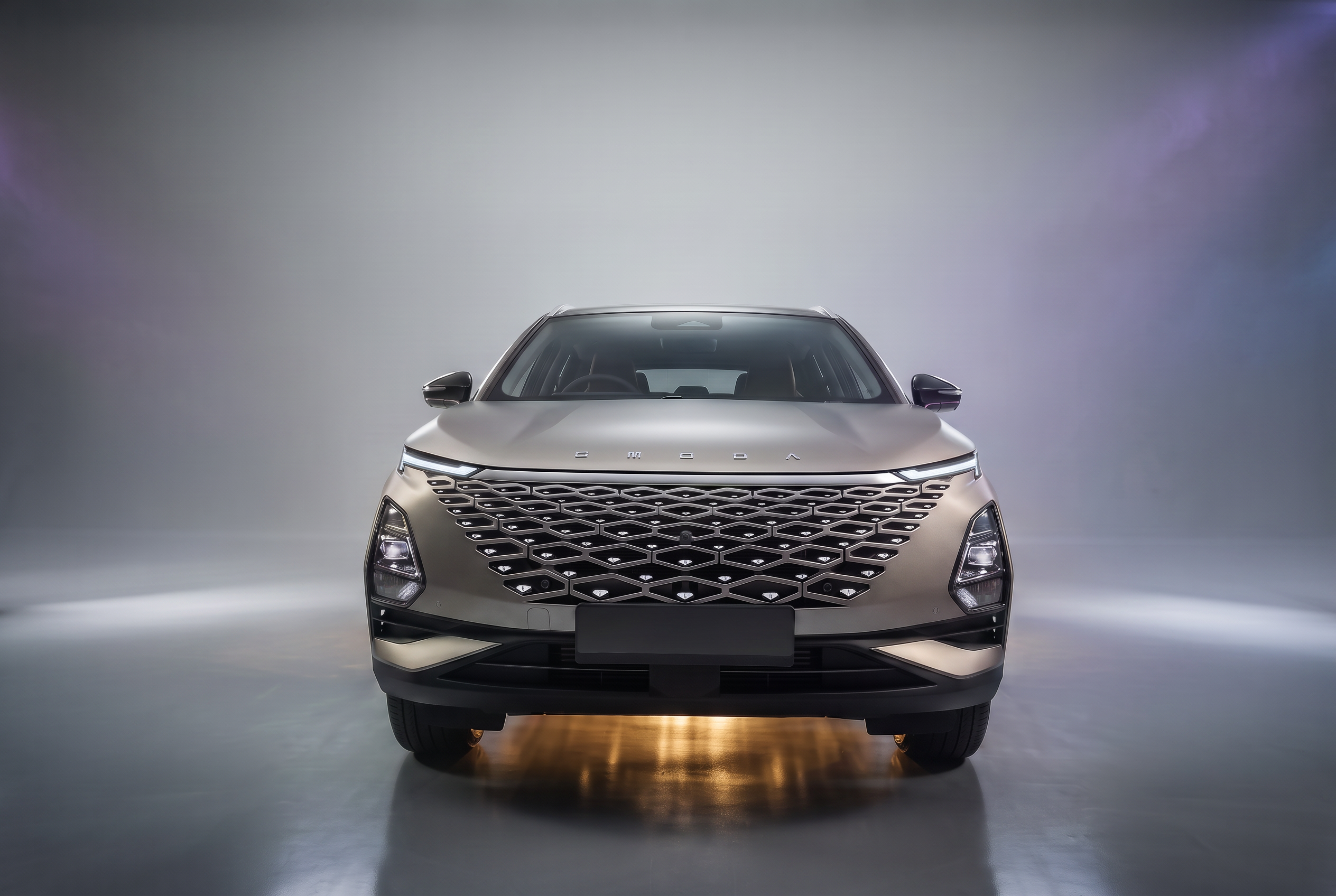 OMODA SUV being driven on an open road
