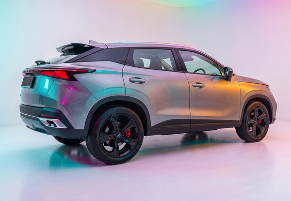 OMODA SUV rear three-quarter view lit by soft rainbow studio lighting
