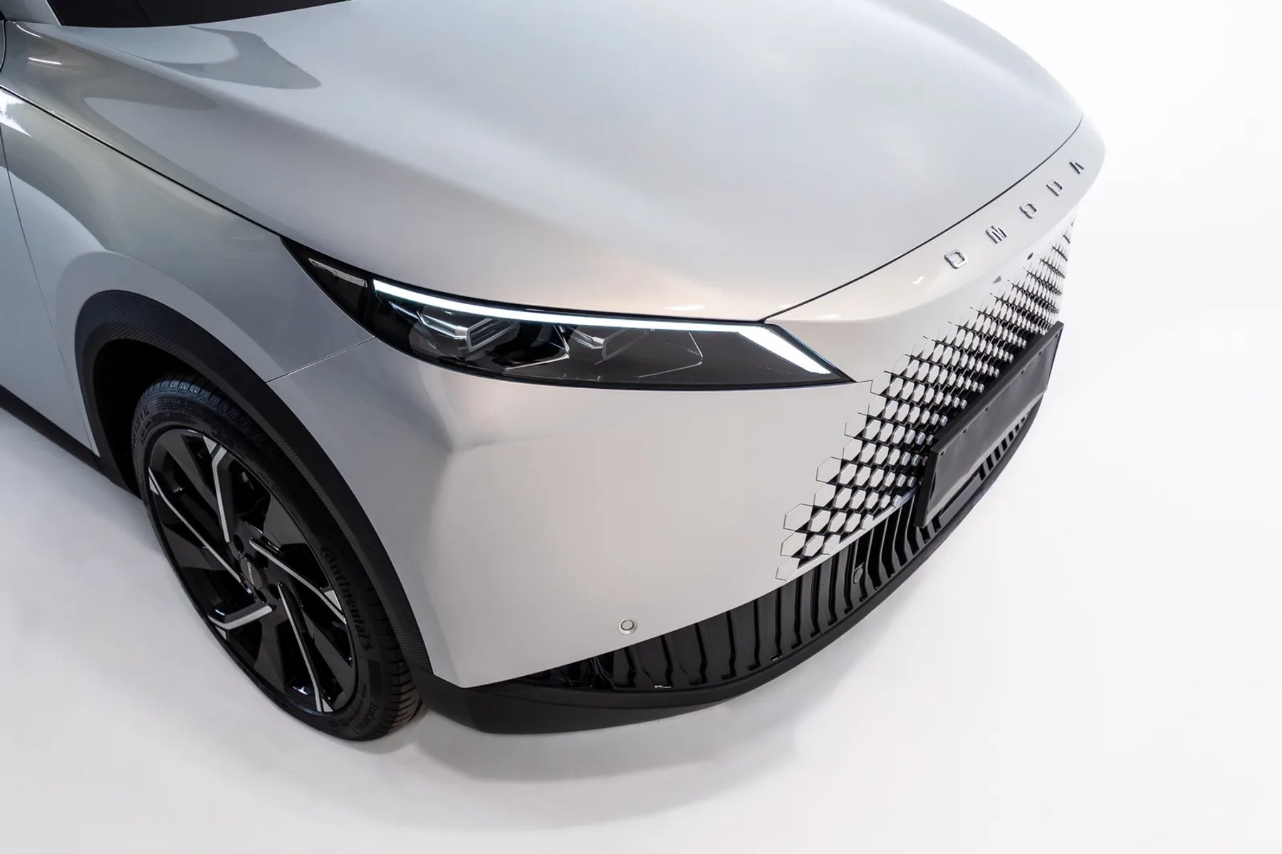 OMODA front grille and headlight close-up