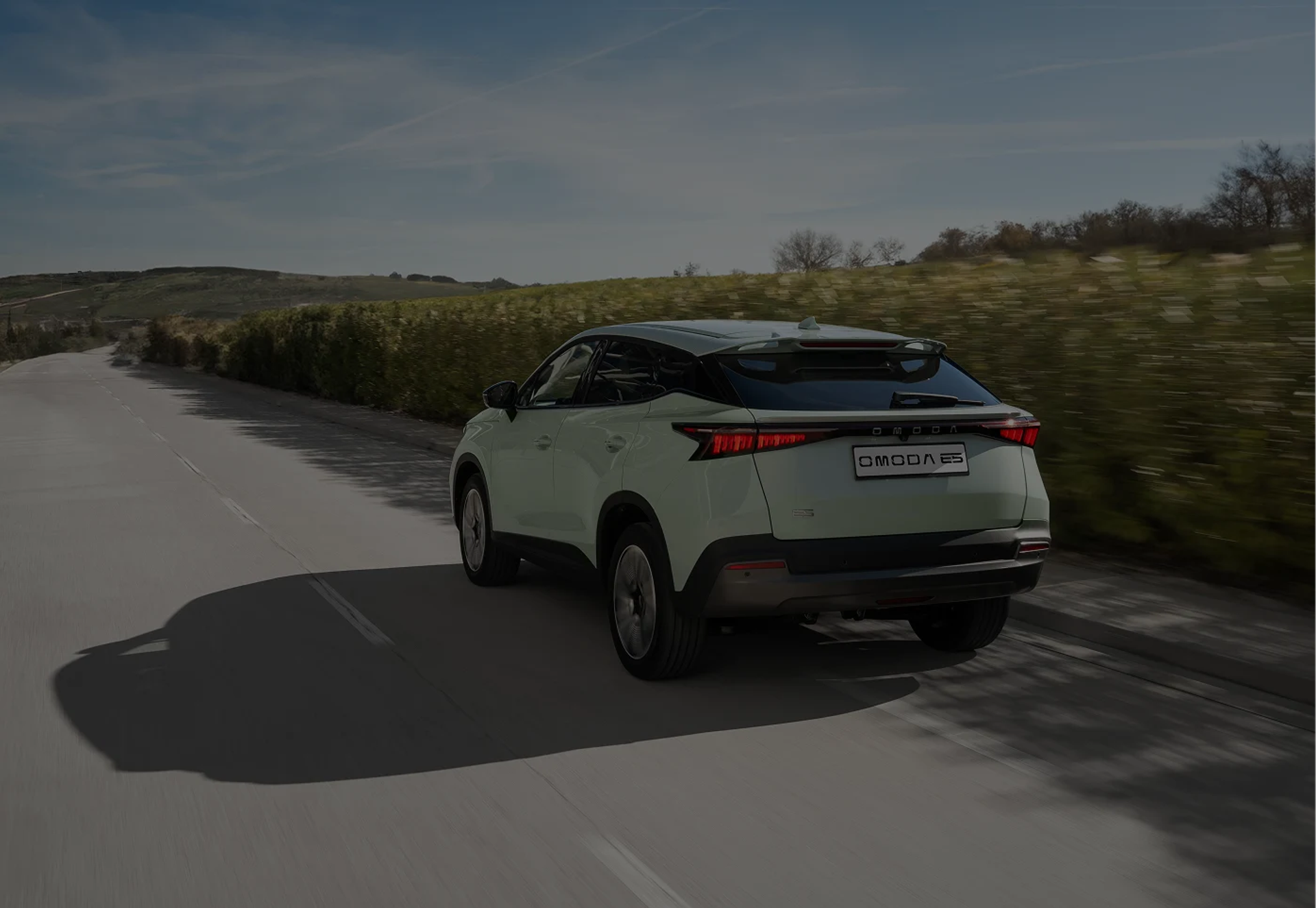 OMODA E5 driving through the countryside