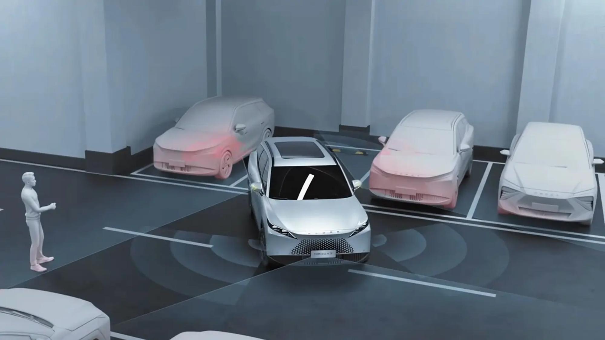 Person uses a key fob to remotely reverse an OMODA 7 into a parking space