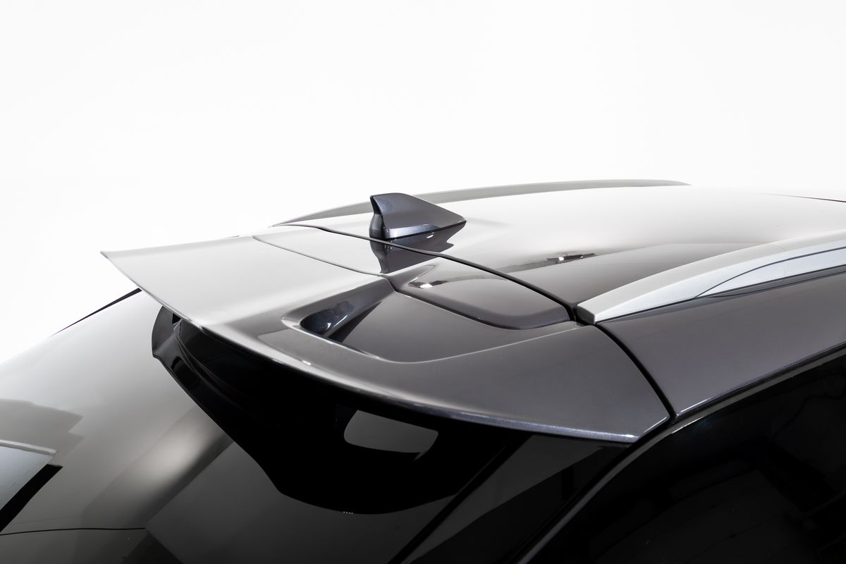 OMODA 5 coupe-inspired roofline flowing into the rear spoiler