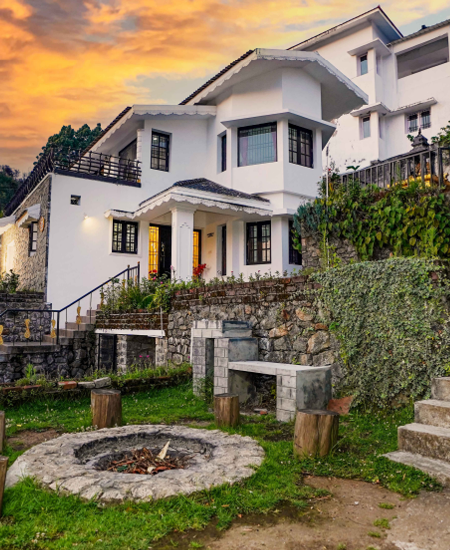 A panoramic view of The Oasis showcasing its hillside setting and surrounding landscape.