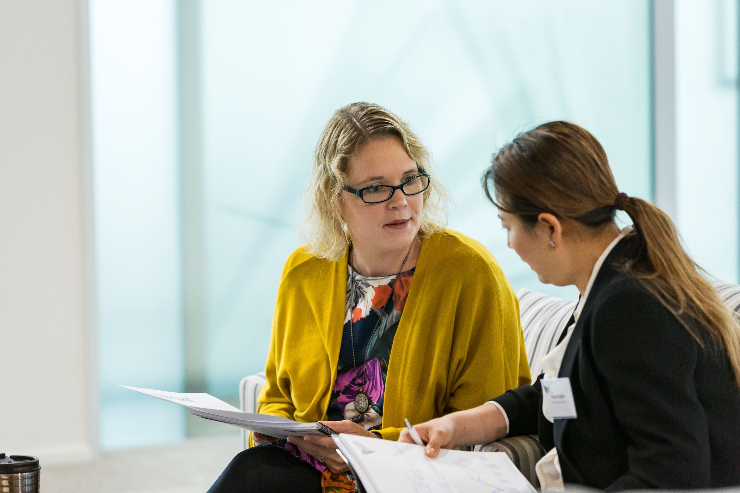 Two women discussion ideas NZIM course
