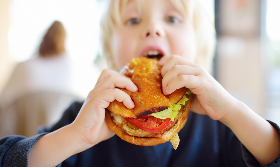 Kid eating a burger