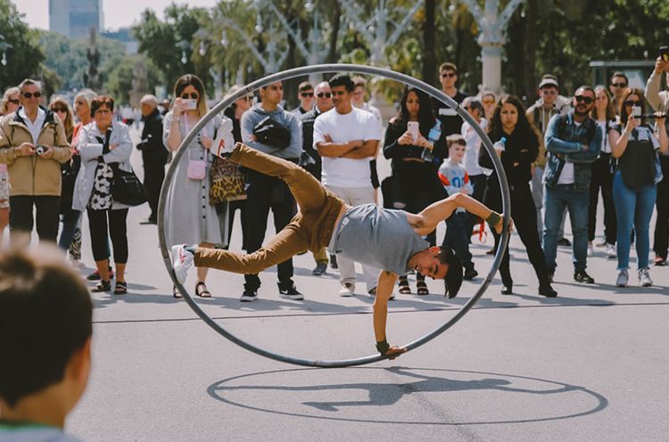 A Group Of People Watching A Band On Stage In Front Of A Crowd