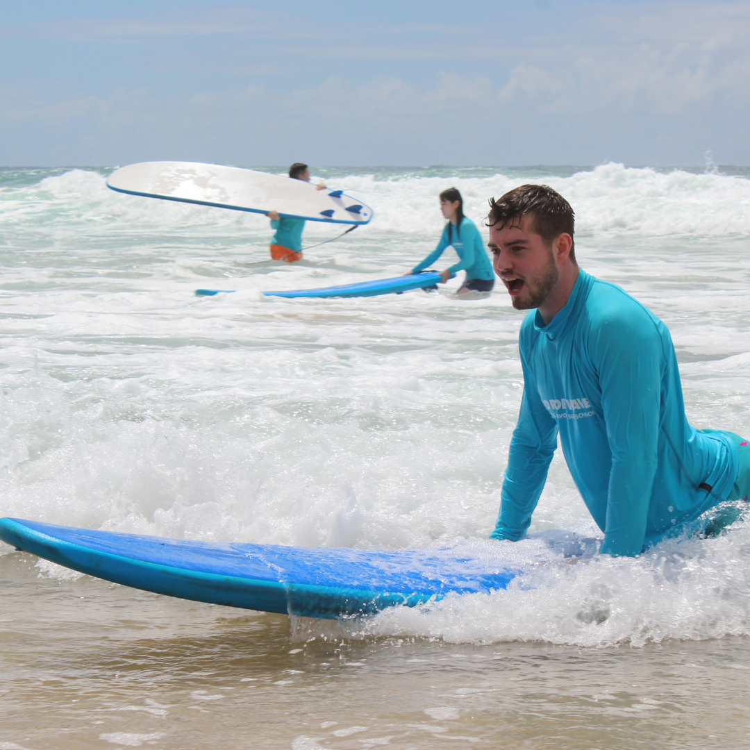 Beginner surfer catching a wave
