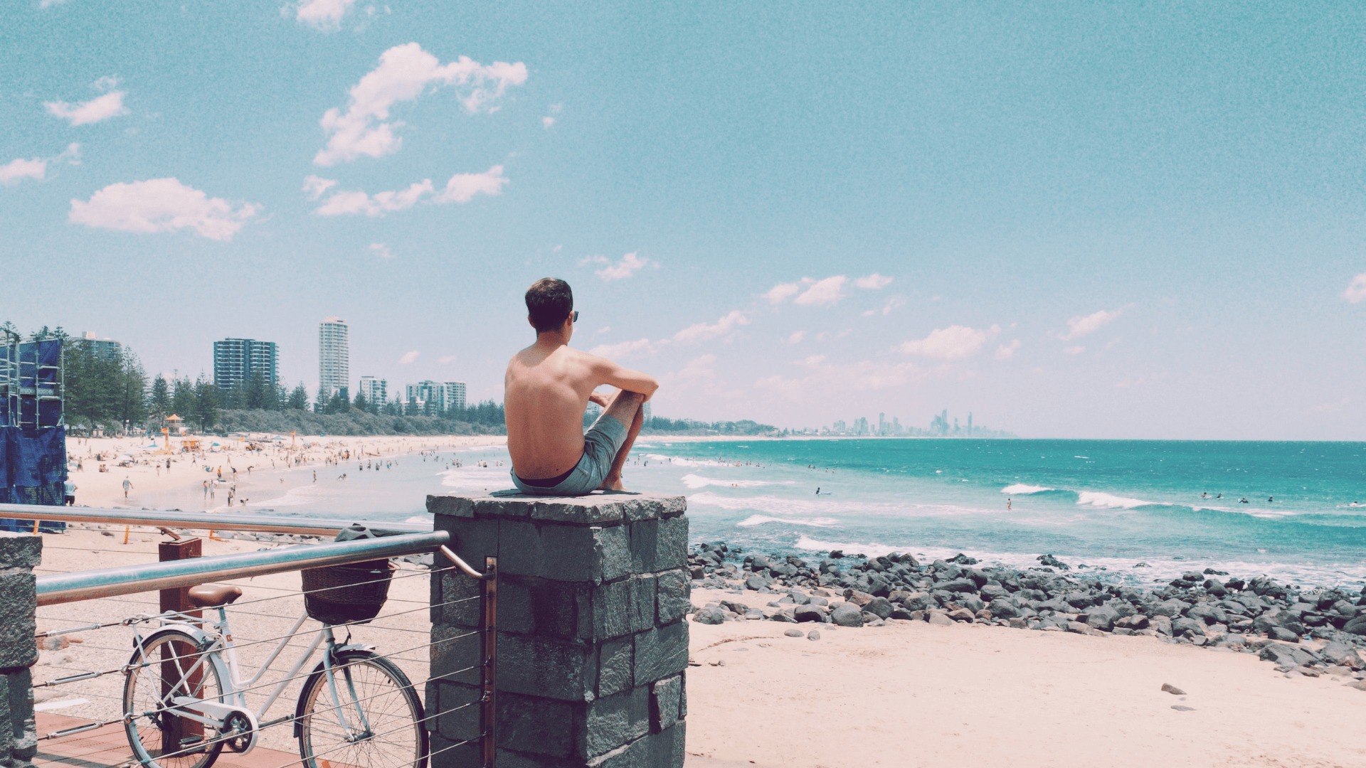 Man-sitting-watching-surf