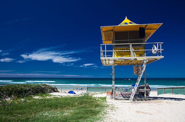 A Yellow Boat Sitting On Top Of A Beach