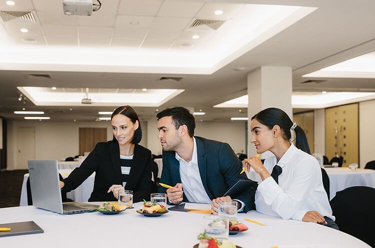 Tonia Renee Et Al. Standing Around A Table