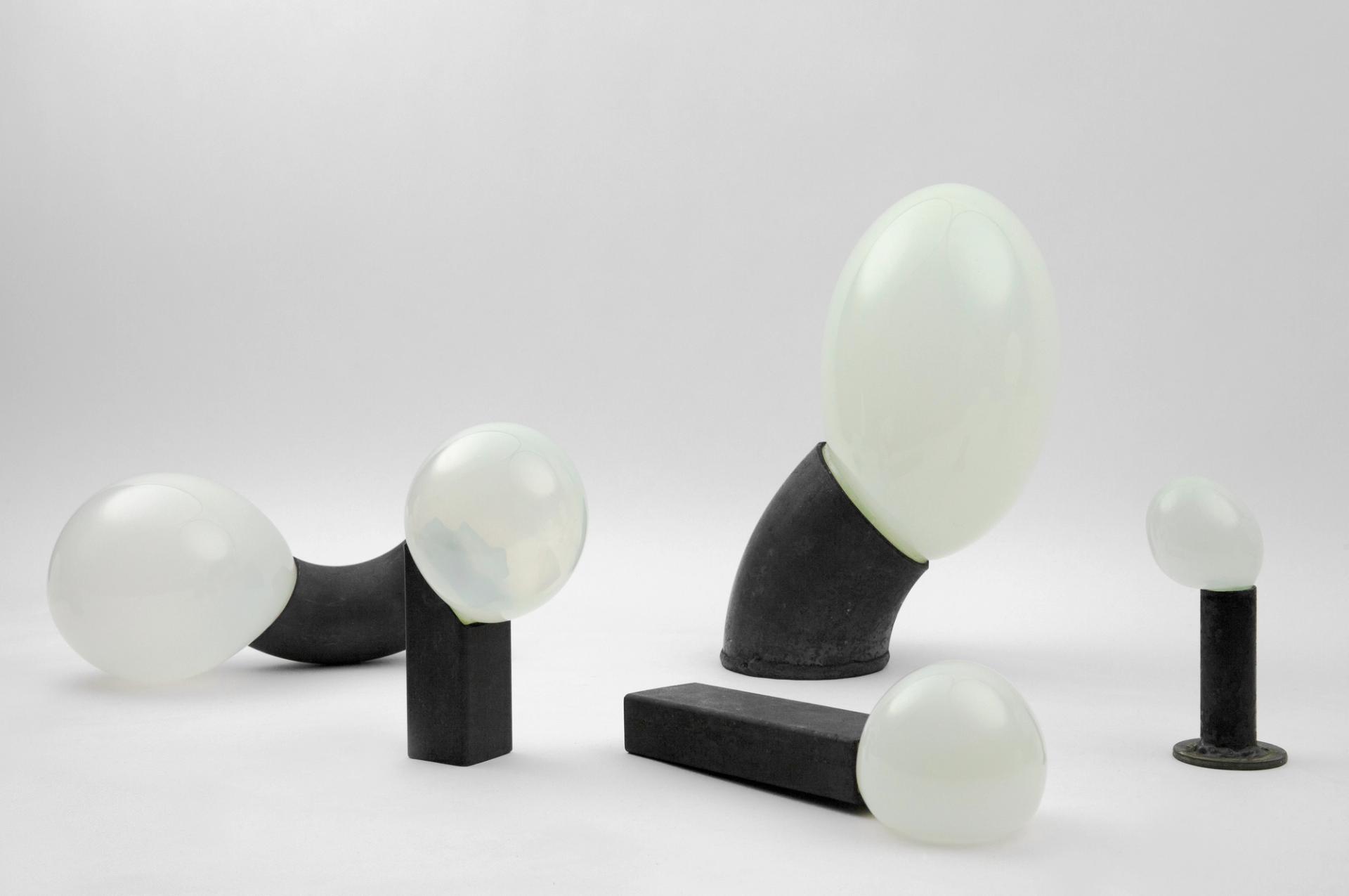 Glass blown through steel pipe offcuts 