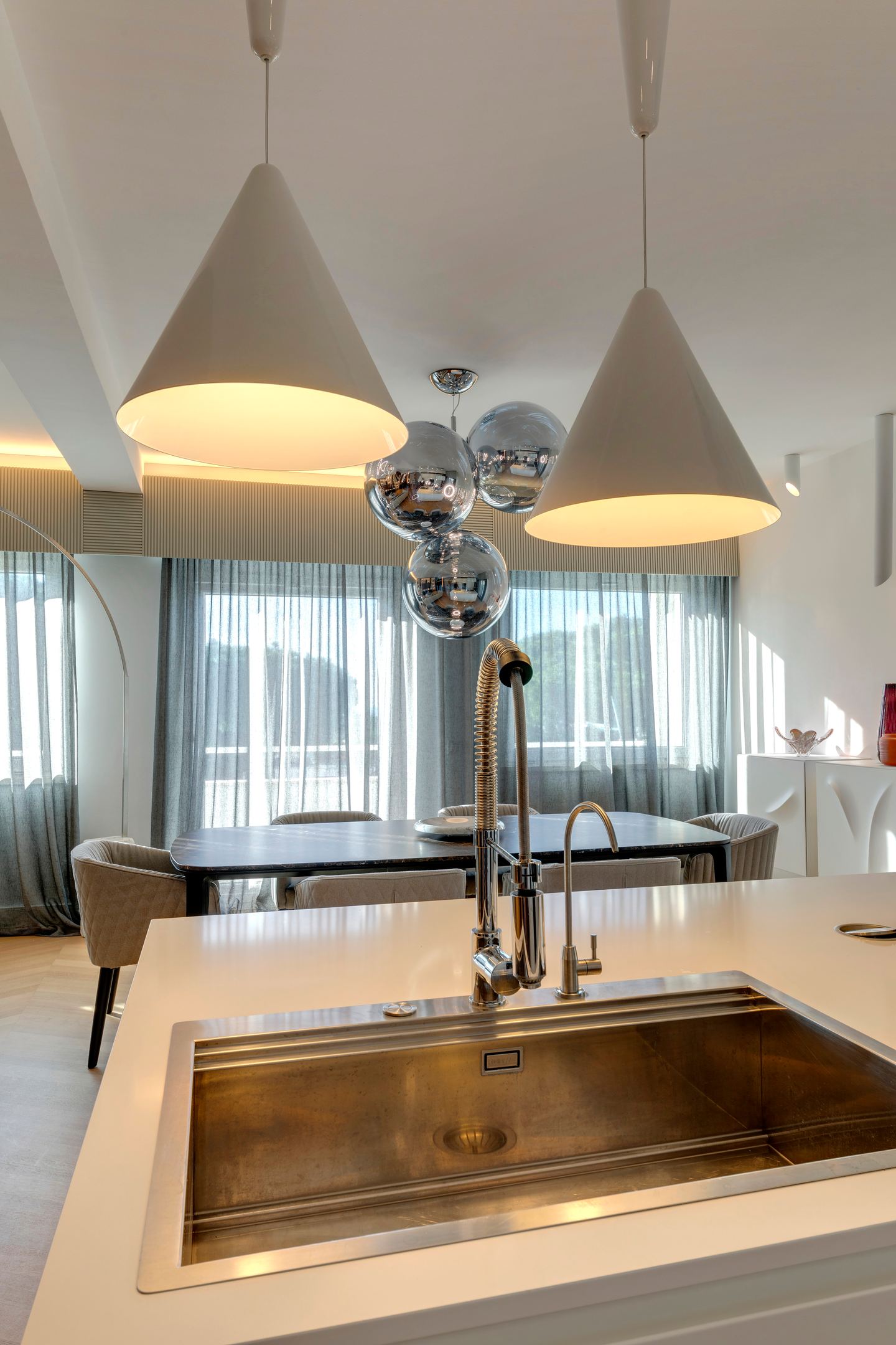 Brushed metal sink set into the island, close