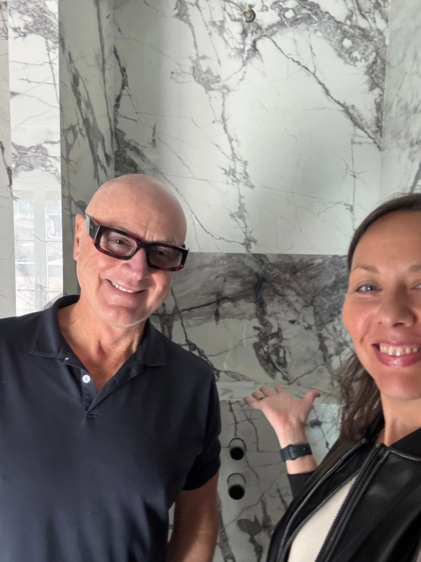 Douglas Atkin and Deniz Önel in front of the new marble