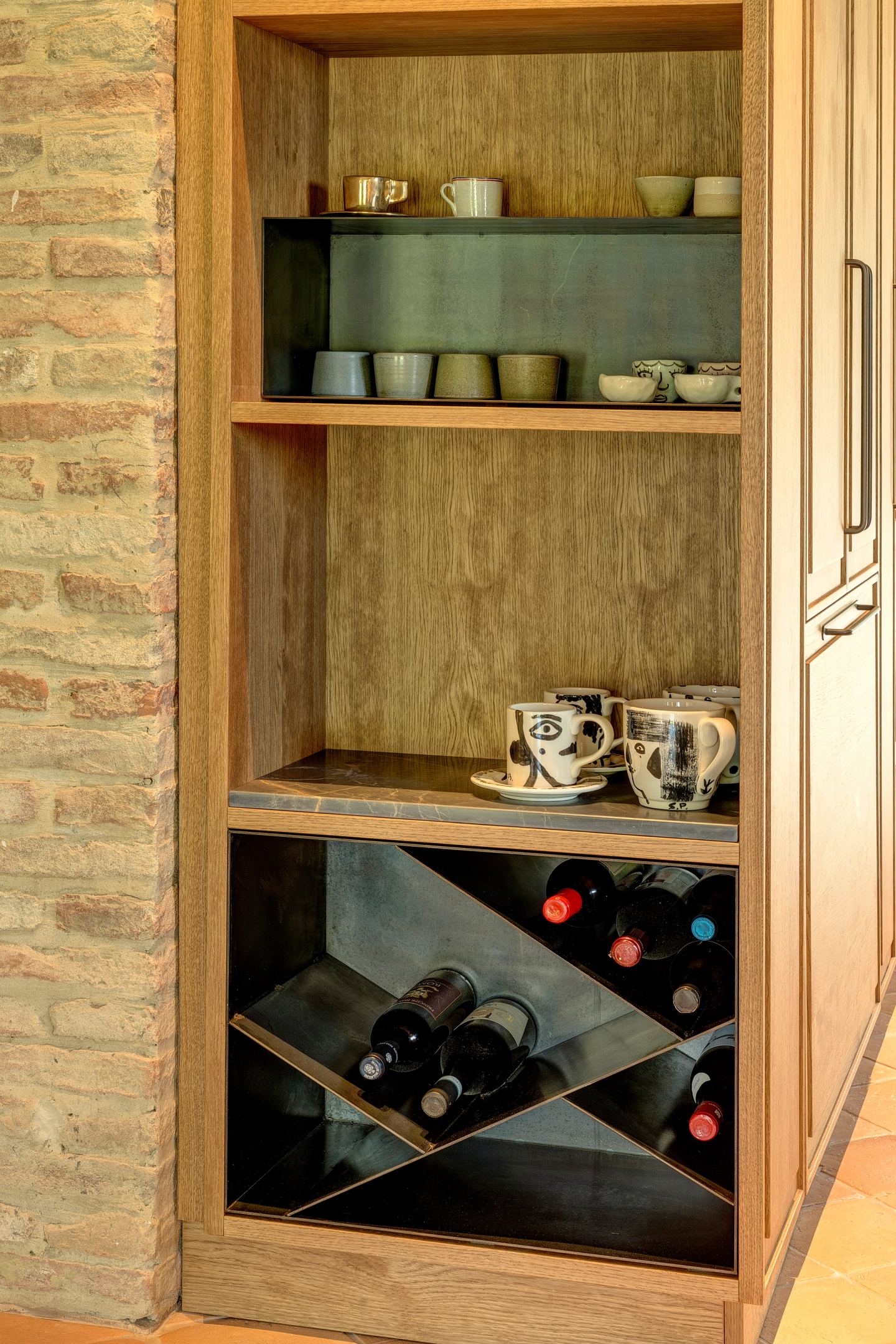 Crockery above, wine below, behind one oak door