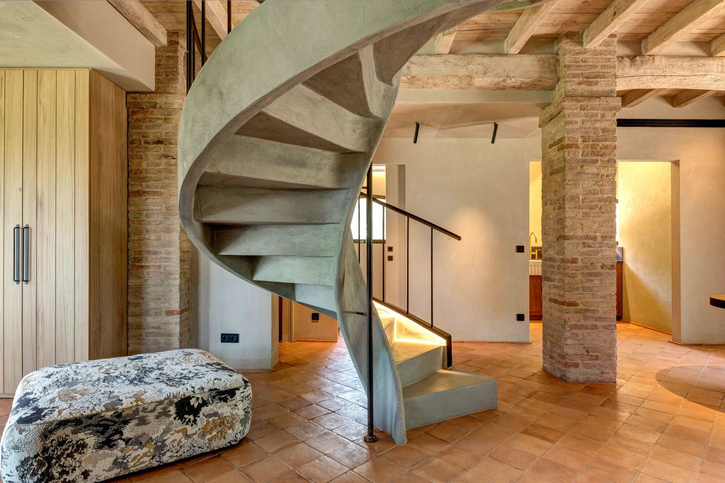 The stair against the white wall and the brick pier