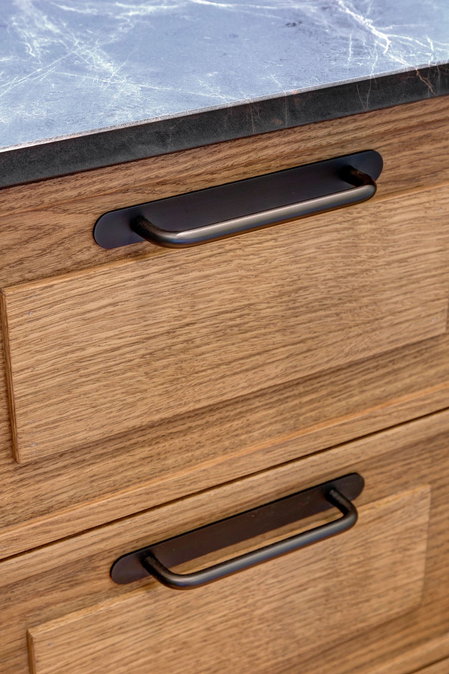 Oak drawer fronts with their dark handles